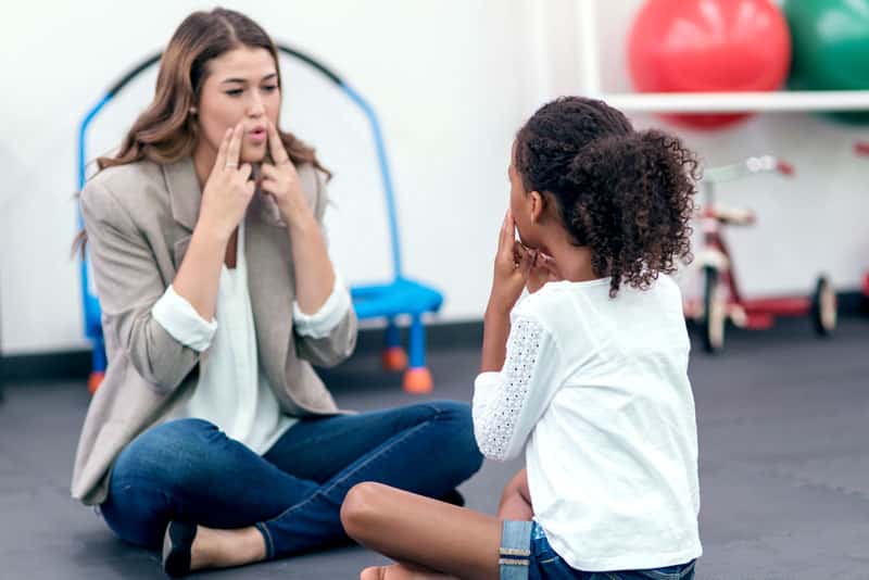 speech pathologist working with child