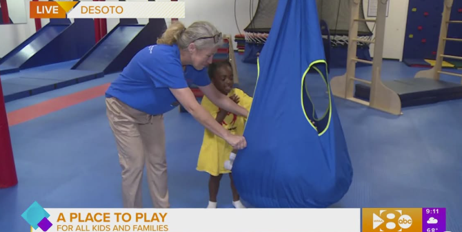 Photo in kids gym of woman and child
